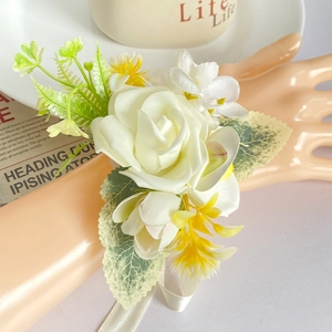 Elegant white artificial rose wrist corsage with yellow accents and satin ribbon