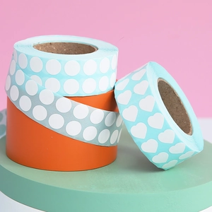 Detailed view of DIY diamond painting sticker rolls in heart and round shapes