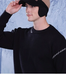 Detailed view of winter knit baseball cap earflaps and premium fleece lining texture