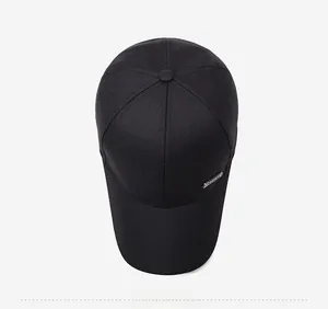 Top down view of black cotton baseball cap showing 6-panel structure and metal logo plate