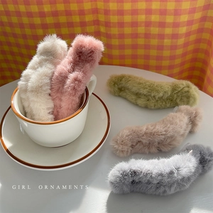 Plush faux fur claw clips in five warm colors for elegant winter hair styling