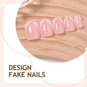 French style short round fake nails with pink base and delicate gold line accents