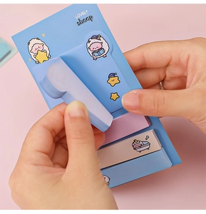 Close-up of cute blue sheep sticky notes being pulled from a lovely stationery set