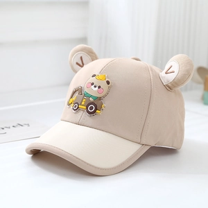 Detail of cute bear embroidery and 3D ears on a beige kids baseball cap