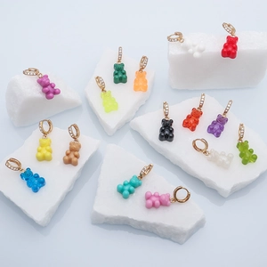 Colorful resin gummy bear hoop earrings with sparkling crystal-encrusted gold fasteners