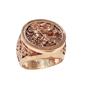 Vintage rose gold ring featuring a detailed equestrian relief carving in a retro style