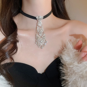 Close-up of sparkling rhinestone necktie choker necklace with intricate tassel details