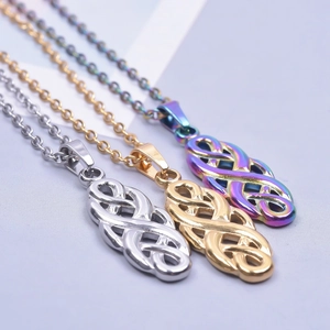 Detailed view of three stainless steel Celtic witch knot pendants in silver gold and rainbow