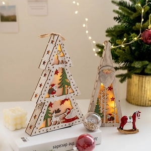 Luminous Christmas wooden LED ornament with Santa Claus and tree on a white table