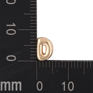 Measurement of golden bubble letter D pendant showing 8mm by 9mm size on a scale