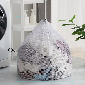 Detail showing white fine mesh laundry bag in 60x80cm size used in a laundry room scene