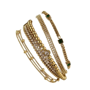 Four-piece gold plated stainless steel bracelet set with green and white gems