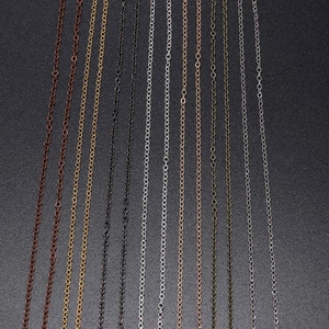 Close-up of multiple metallic finish DIY link chains in gold silver and bronze tones