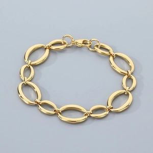 Detailed view of oval link chain gold bracelet featuring a secure lobster clasp