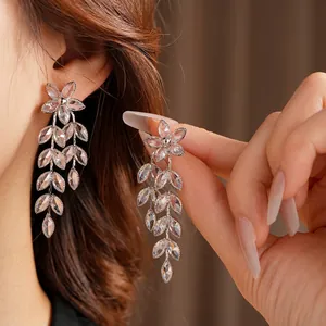 Elegant silver flower earrings with long leaf tassels and sparkling crystals for women