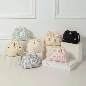 Quilted cotton drawstring cosmetic bags with bear and floral patterns for travel storage