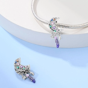Silver crescent moon dreamcatcher charm with colorful gemstones and purple feathers