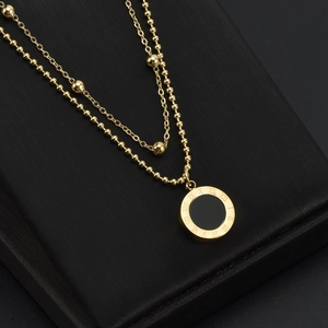 Double-layered 18k gold plated titanium necklace with black shell and Roman numerals
