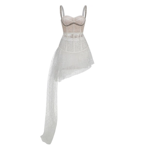 Detail of white mesh dress with sheer straps and sparkling sequins and rhinestones