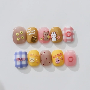 Handmade press-on nails featuring cute cartoon bear and bunny designs with macaron colors