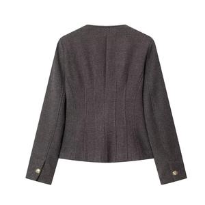 Detail view of the back of a charcoal grey tweed jacket with golden cuff buttons