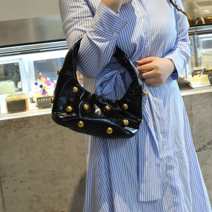 Fashionable black faux leather shoulder bag with vintage gold stud embellishments for women