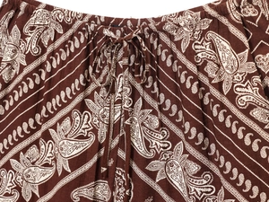 Detailed macro view of the elastic waistband with drawstring on paisley print pants