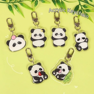 Cute acrylic panda keychain set with bamboo and apple charms for backpacks and accessories