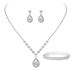 Close-up of bridal jewelry set with pear-shaped cubic zirconia in silver-plated metal