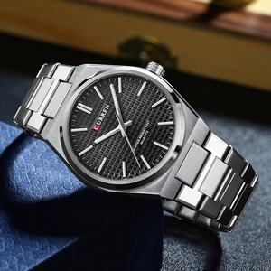 Close-up of Curren men's silver stainless steel watch with black textured dial and quartz movement
