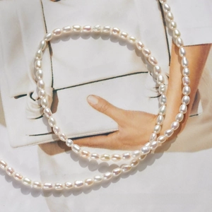 Close-up of white freshwater rice pearls with natural luster on a fashion magazine