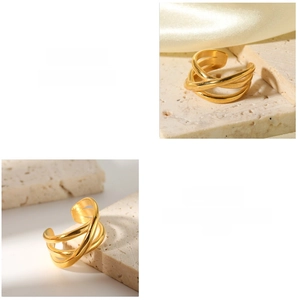 Macro detail of 18K gold-plated multilayer crisscross ring with polished finish