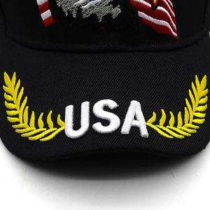 Close-up of USA embroidery and golden wheat stalks on a black cotton baseball cap