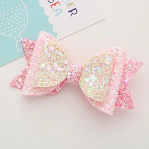 Detailed view of pink multi-layered hair clip with glitter and large sequins for girls