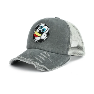 Detailed macro view of distressed grey cotton brim with football patch and white mesh