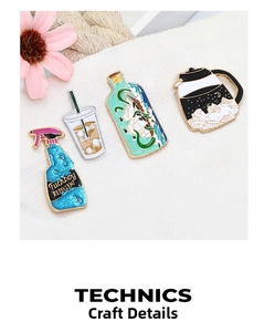 Detailed view of creative enamel pins featuring a spray bottle and glittery coffee designs