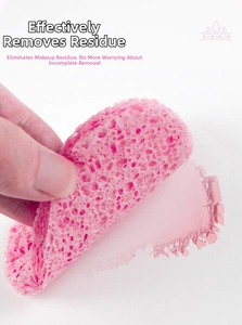Close-up of pink heart-shaped facial sponge effectively removing makeup powder residue