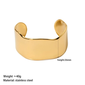 Polished wide gold stainless steel wavy cuff bracelet with 36mm height and 40g weight