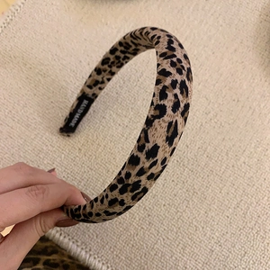 Detail of handmade leopard print headband with inner hand made label and plush texture