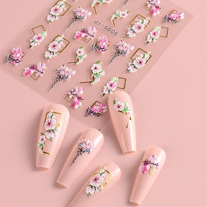 Detail of 5D pink camellia nail stickers with gold frame and love text accents