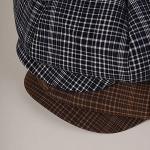 Vintage blue and brown plaid octagonal newsboy cap with premium woven fabric texture