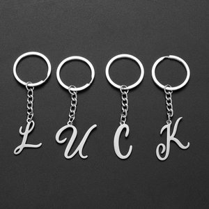 Set mit 4 Vintage-Metall-Schlüsselanhängern mit L-U-C-K Buchstaben-Anhängern in Silber