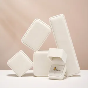 White velvet jewelry display set featuring premium ring box and display stands