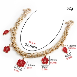 Detail view of 32.5cm gold chain with red enamel flowers and precise size annotations