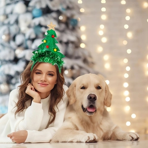 Green Christmas tree headband with gold star and ornaments worn in a festive scene