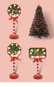 Detail view of red LED Christmas stop signs and mini tree for holiday decor
