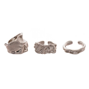 Three-piece set of silver irregular molten metal rings with fluid geometric design