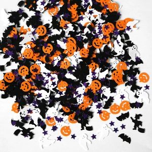 Mix of Halloween confetti with orange pumpkins, white ghosts, and black bats on white