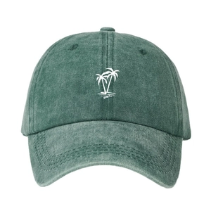 Washed dark green baseball cap featuring white palm tree embroidery in a casual outdoor style