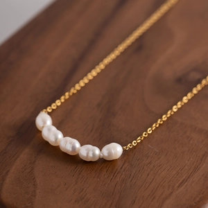 Gold-plated stainless steel necklace featuring five natural freshwater pearls on a fine chain